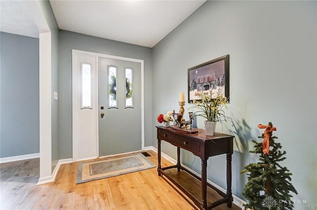 entryway with hardwood / wood-style flooring