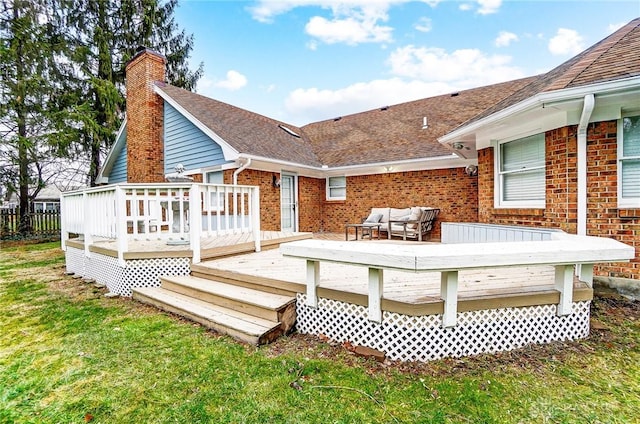 rear view of house with a yard, an outdoor hangout area, and a deck