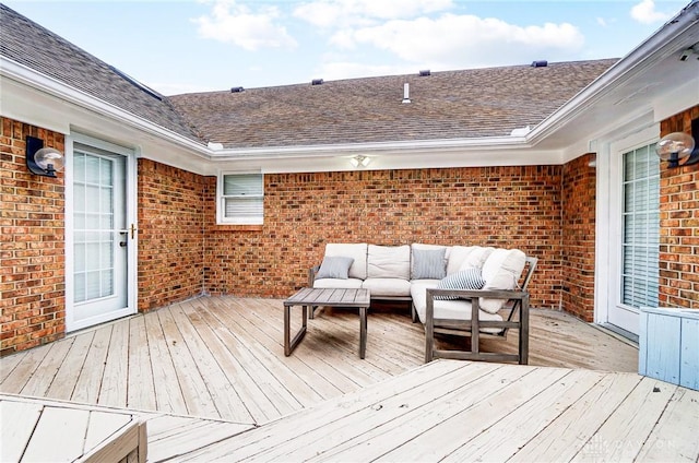 wooden deck with an outdoor living space