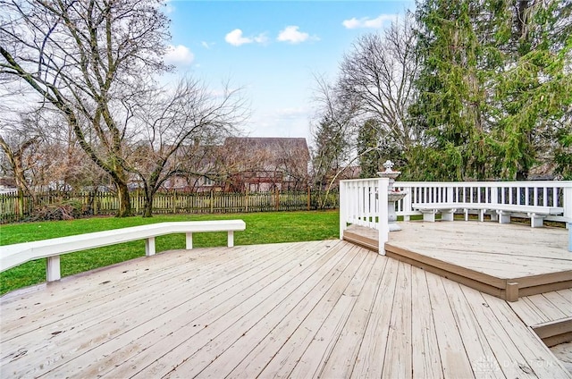 wooden deck with a lawn