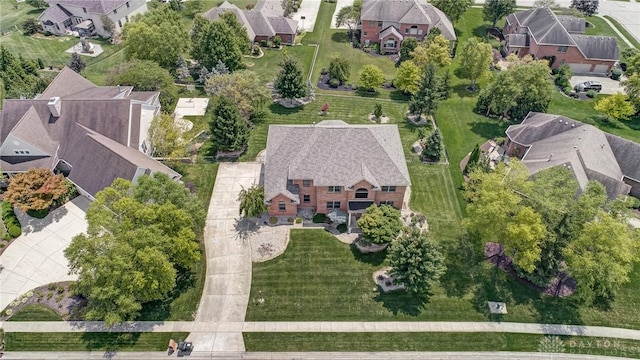 birds eye view of property with a residential view