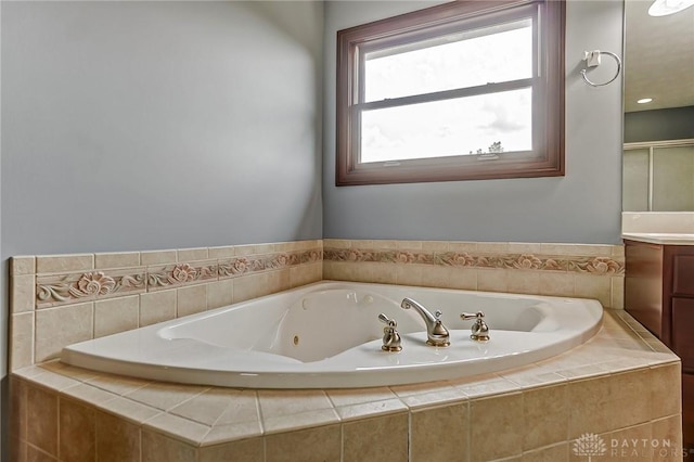 bathroom featuring vanity and a whirlpool tub