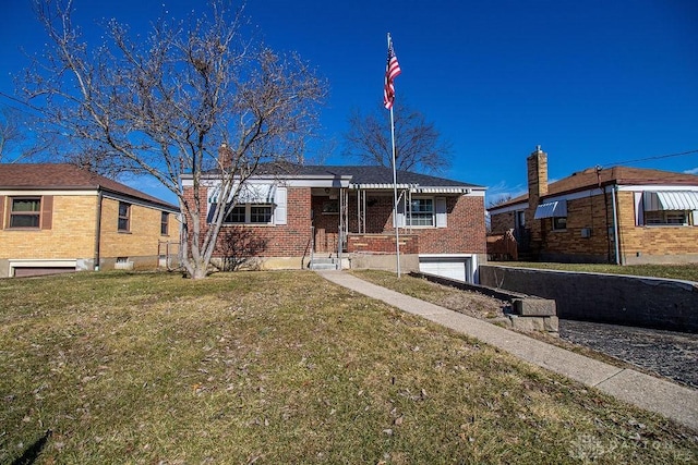 single story home with a garage and a front lawn