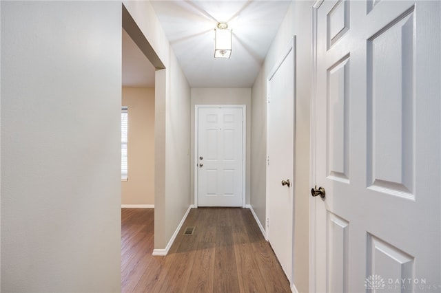 hall with wood-type flooring