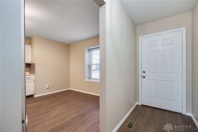 foyer entrance with hardwood / wood-style floors