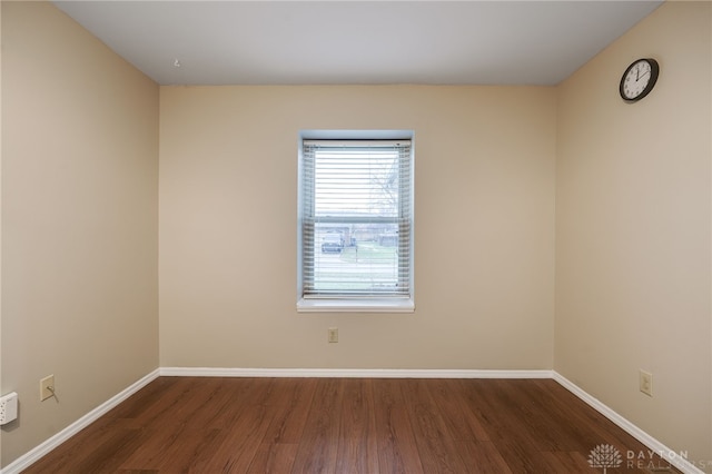 empty room featuring dark hardwood / wood-style floors