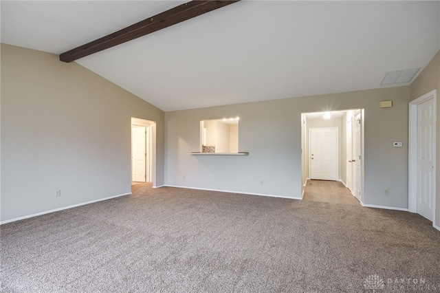 unfurnished living room featuring vaulted ceiling with beams and light carpet