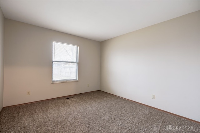 empty room with carpet flooring