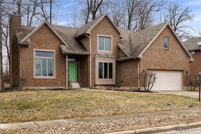 view of front of property with a garage and a front yard