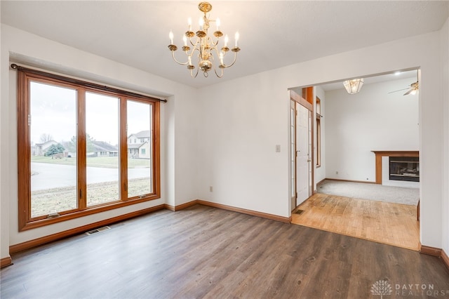 interior space with an inviting chandelier and hardwood / wood-style floors