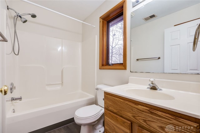 full bathroom with vanity, shower / washtub combination, and toilet