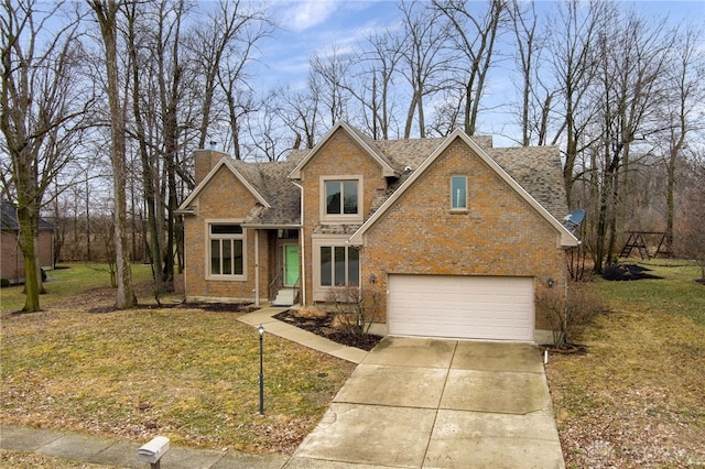 view of front of property featuring a garage and a front lawn