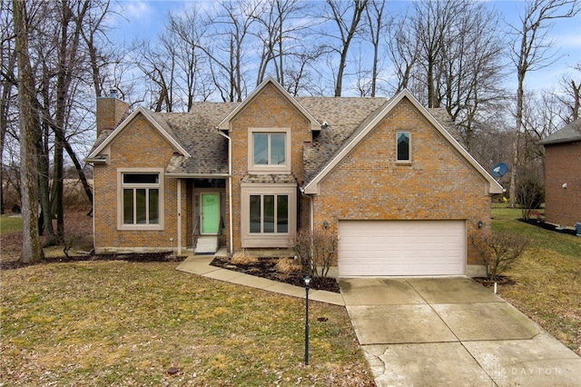 view of front of home with a garage and a front yard