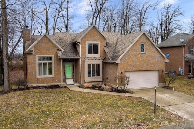 view of front of home with a garage and a front yard