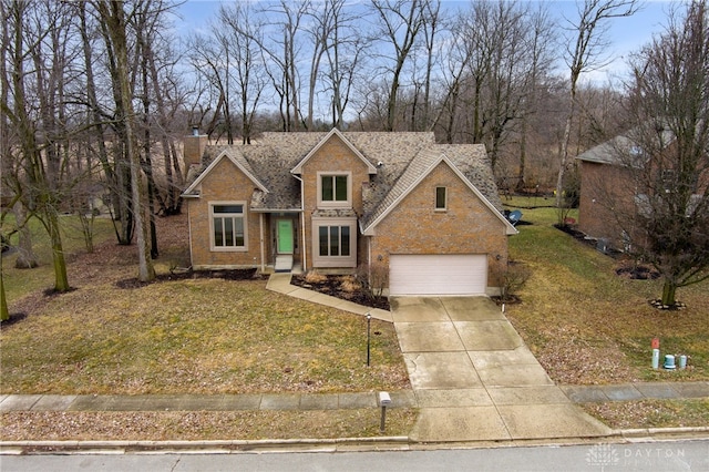 view of front of house featuring a garage and a front lawn