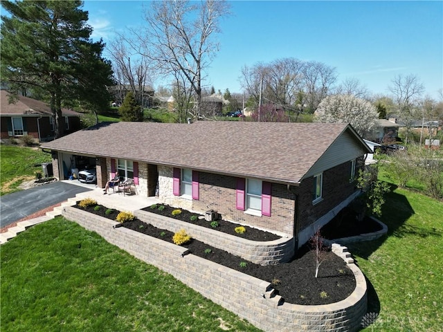 single story home featuring a patio area and a front lawn