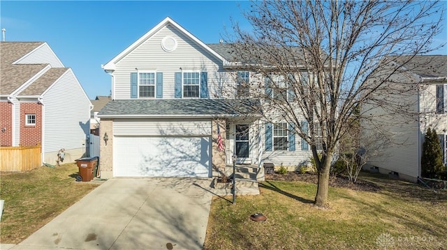 view of front property with a garage and a front yard