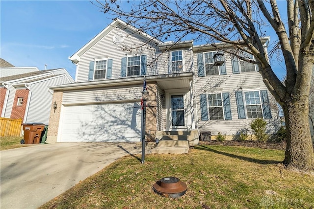 view of front of property featuring a garage and a front yard