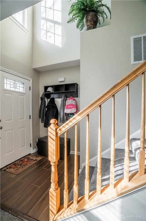 entrance foyer featuring a high ceiling and hardwood / wood-style floors