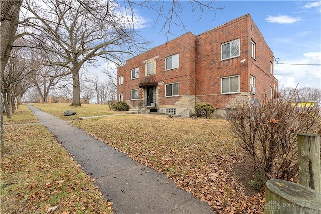 602 Rockford Ave, Dayton, OH 45405 - exterior space with brick siding and a front yard