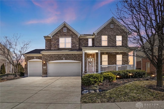 view of front of home featuring a garage and a porch