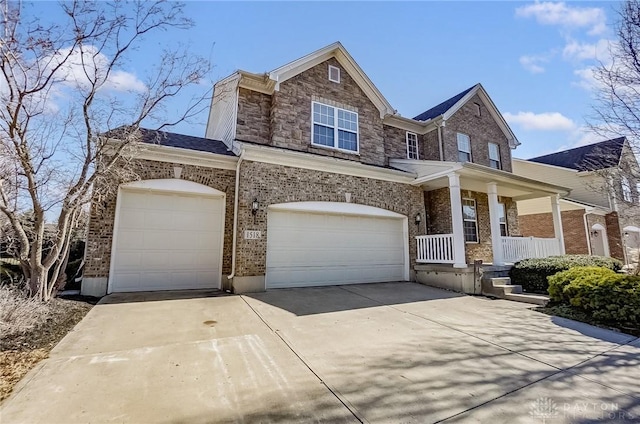 view of front of house with a garage and a porch