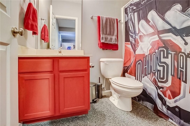 bathroom with vanity, walk in shower, and toilet