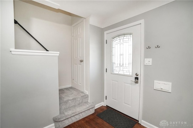 entryway with dark wood-type flooring