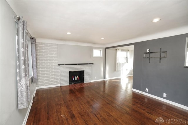 unfurnished living room featuring hardwood / wood-style floors and a fireplace