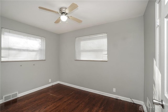 empty room featuring dark hardwood / wood-style floors and ceiling fan