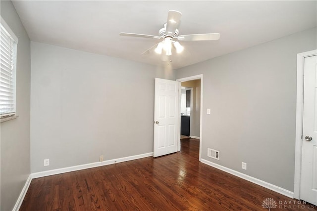 unfurnished bedroom featuring dark hardwood / wood-style floors and ceiling fan