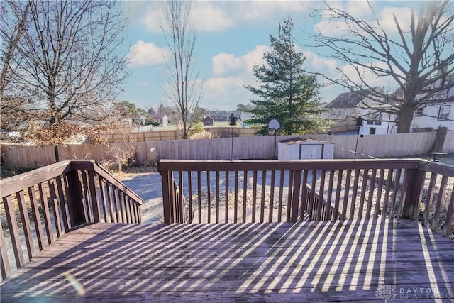 wooden deck featuring a shed