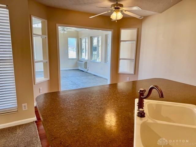 kitchen with ceiling fan and sink