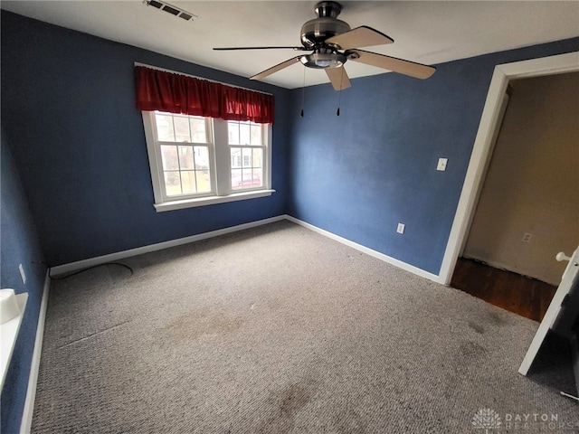 unfurnished room featuring carpet and ceiling fan