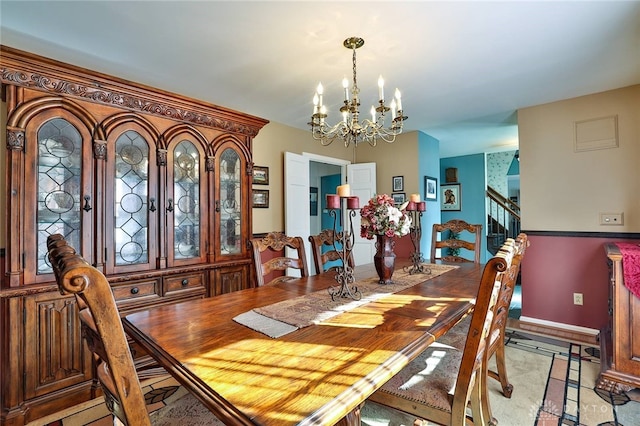 dining space with a chandelier