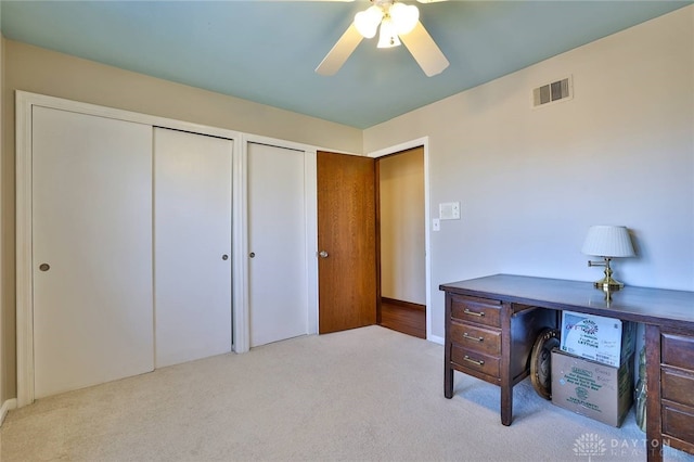 office featuring light colored carpet and ceiling fan