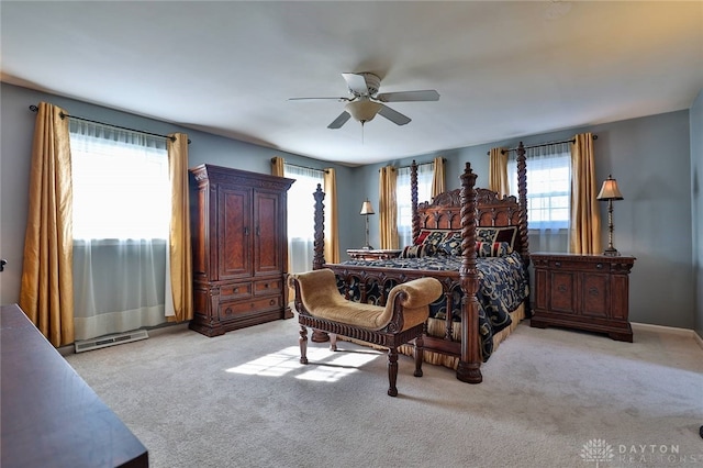 bedroom with light carpet and ceiling fan