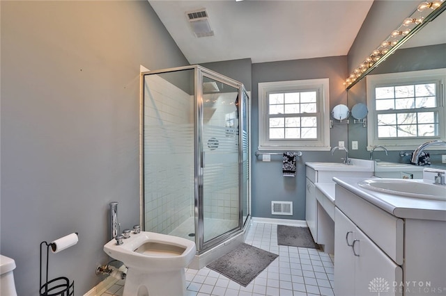 bathroom with a bidet, an enclosed shower, vanity, and tile patterned floors