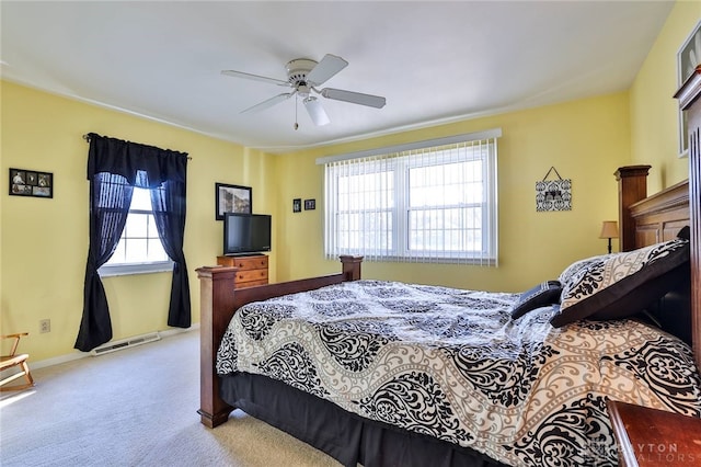 bedroom featuring light colored carpet and ceiling fan