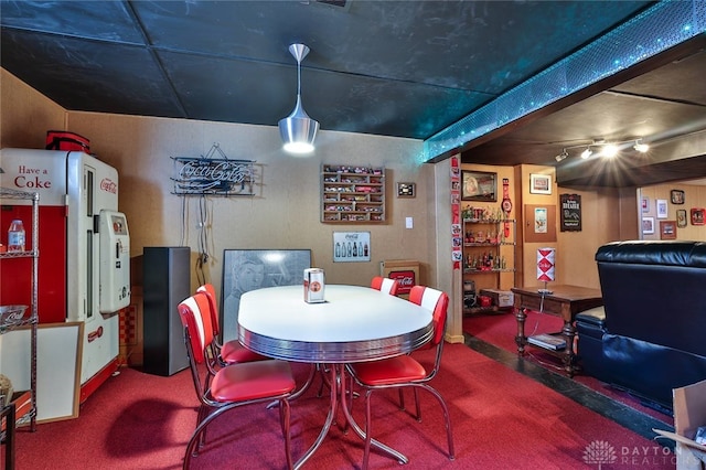 dining space featuring carpet