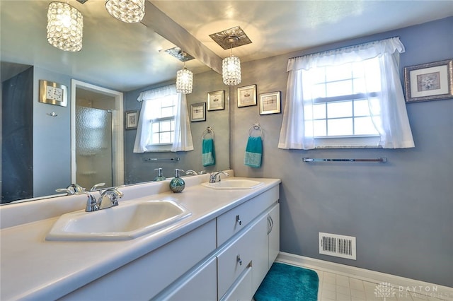 bathroom featuring vanity and a healthy amount of sunlight