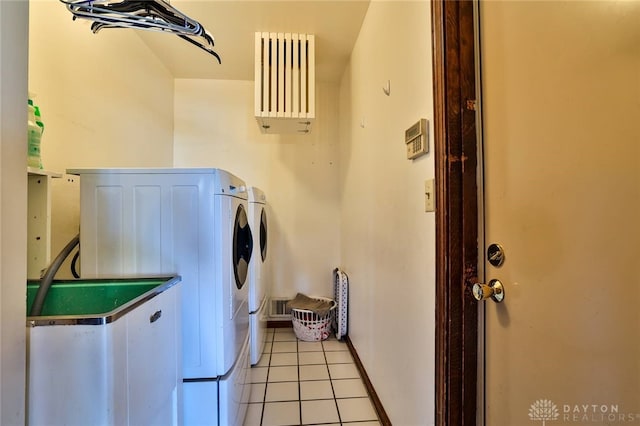 washroom featuring light tile patterned floors and washer and dryer