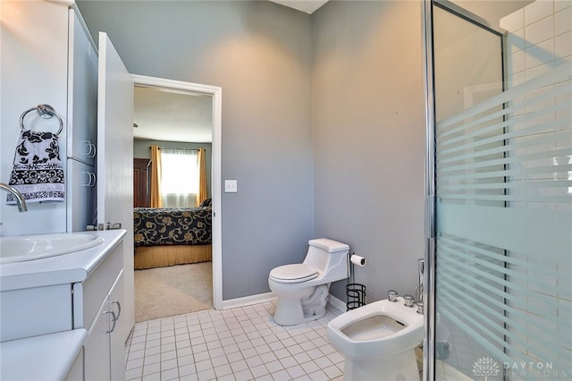 bathroom with a bidet, tile patterned flooring, vanity, an enclosed shower, and toilet