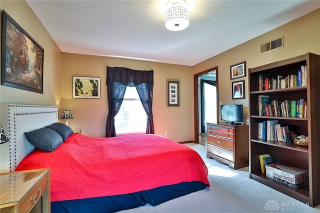 bedroom with light carpet