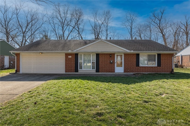 ranch-style house with a garage and a front lawn