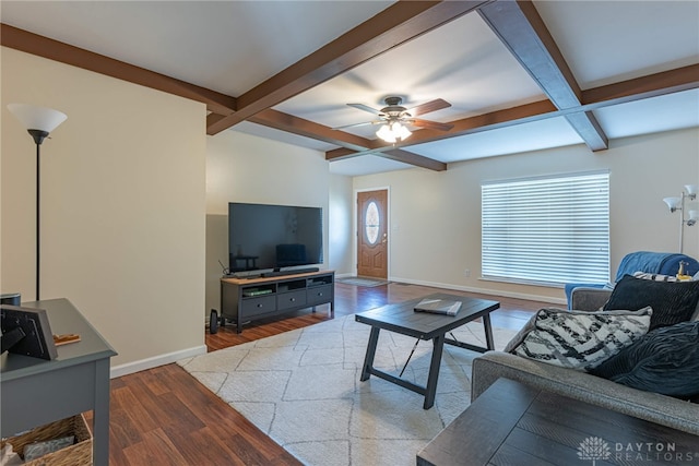 living room with coffered ceiling, ceiling fan, wood-type flooring, and beamed ceiling