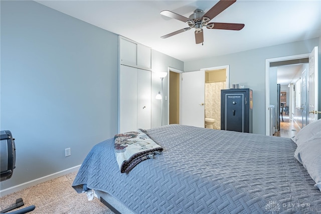 carpeted bedroom with ceiling fan, connected bathroom, and a closet