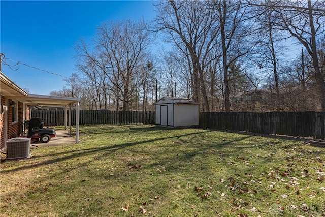 view of yard featuring central AC unit and a shed