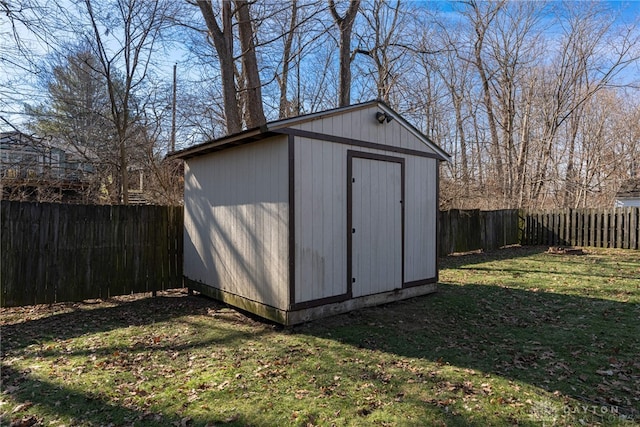 view of outdoor structure featuring a lawn