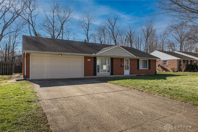 single story home featuring a garage and a front lawn